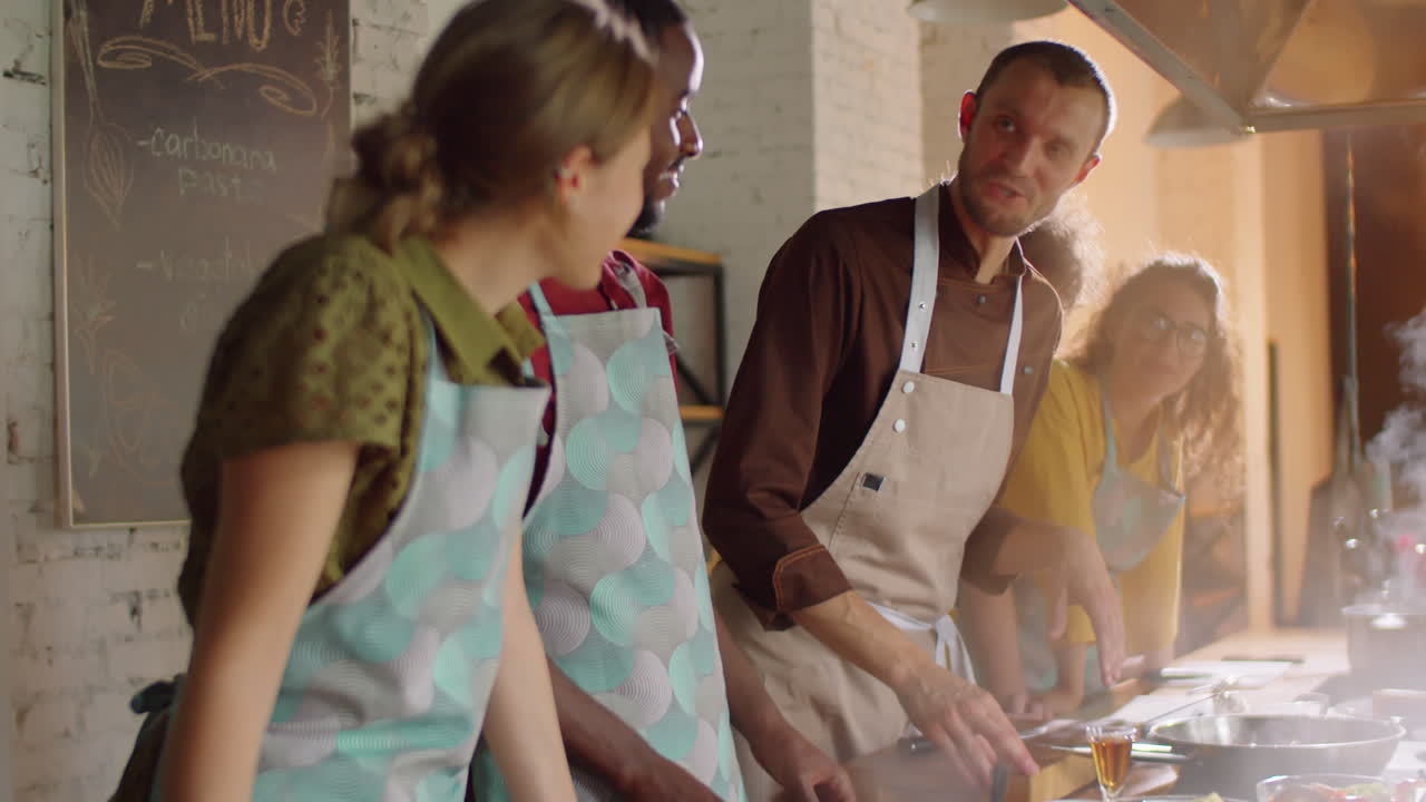 Chef Giving Cooking Class to Diverse Students
