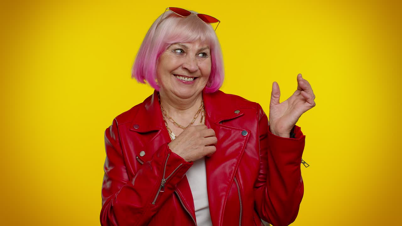Ambitious senior woman winner of lottery posing for photographers, successful famous rich person