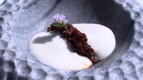 modern gourmet dish with smoked meat and foam