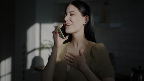 woman on phone call in kitchen