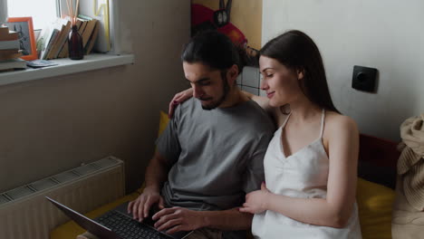 Couple-sitting-on-the-sofa-at-home