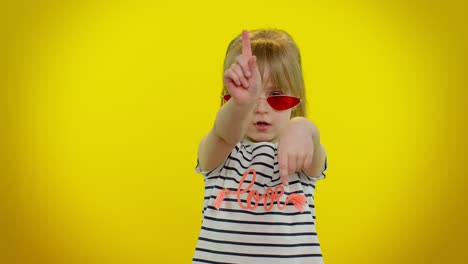 Happy-joyful-child-kid-girl-in-sunglasses-listening-music-dancing-disco,-fooling-around,-having-fun