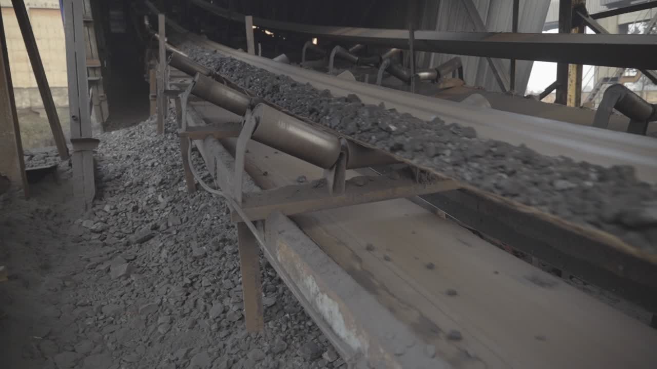 Closeup of conveyor belt transporting coal, Coal preparation plant in Bokaro, Jharkhand