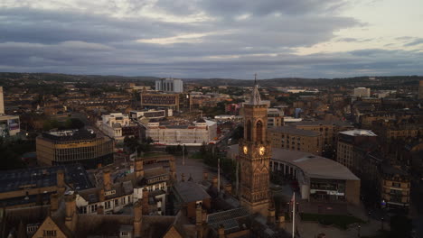 establishing drone shot over bradford city centre at sunrise