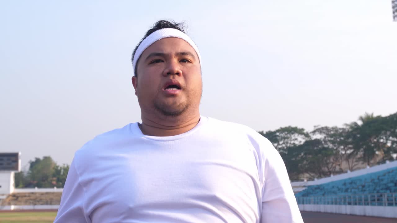 Tired Fat Man Resting After Running