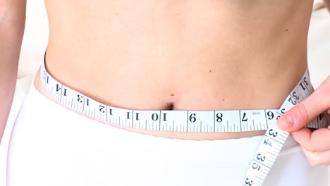 young woman with a tape measure