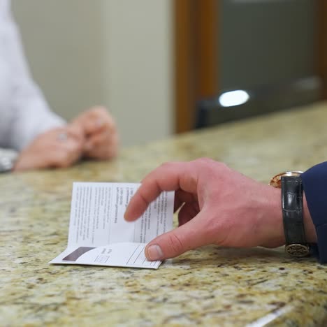 receptionists at hotel desk. receptionist giving key at the hotel reception desk