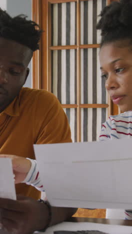 video of focused african american couple planning home budget