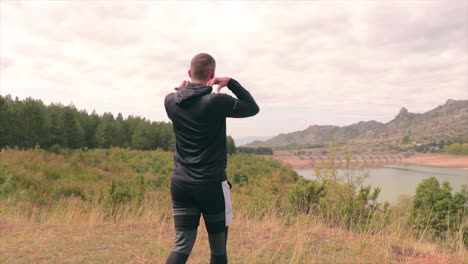 man arriving at a vintage point at the end of the forest