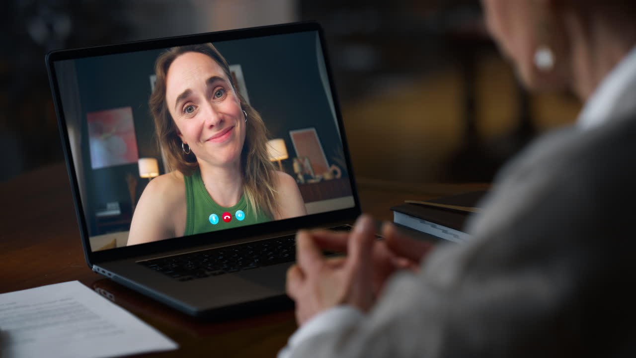 Lady video calling computer at dark room closeup. Woman enjoying virtual chat
