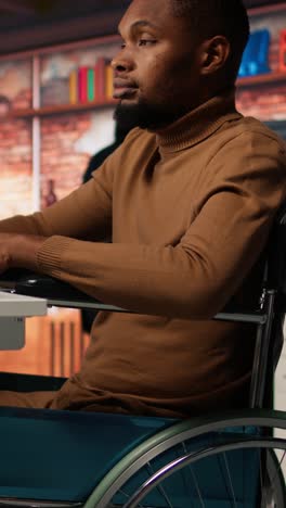 vertical video man in wheelchair working in inclusive ai tech agency