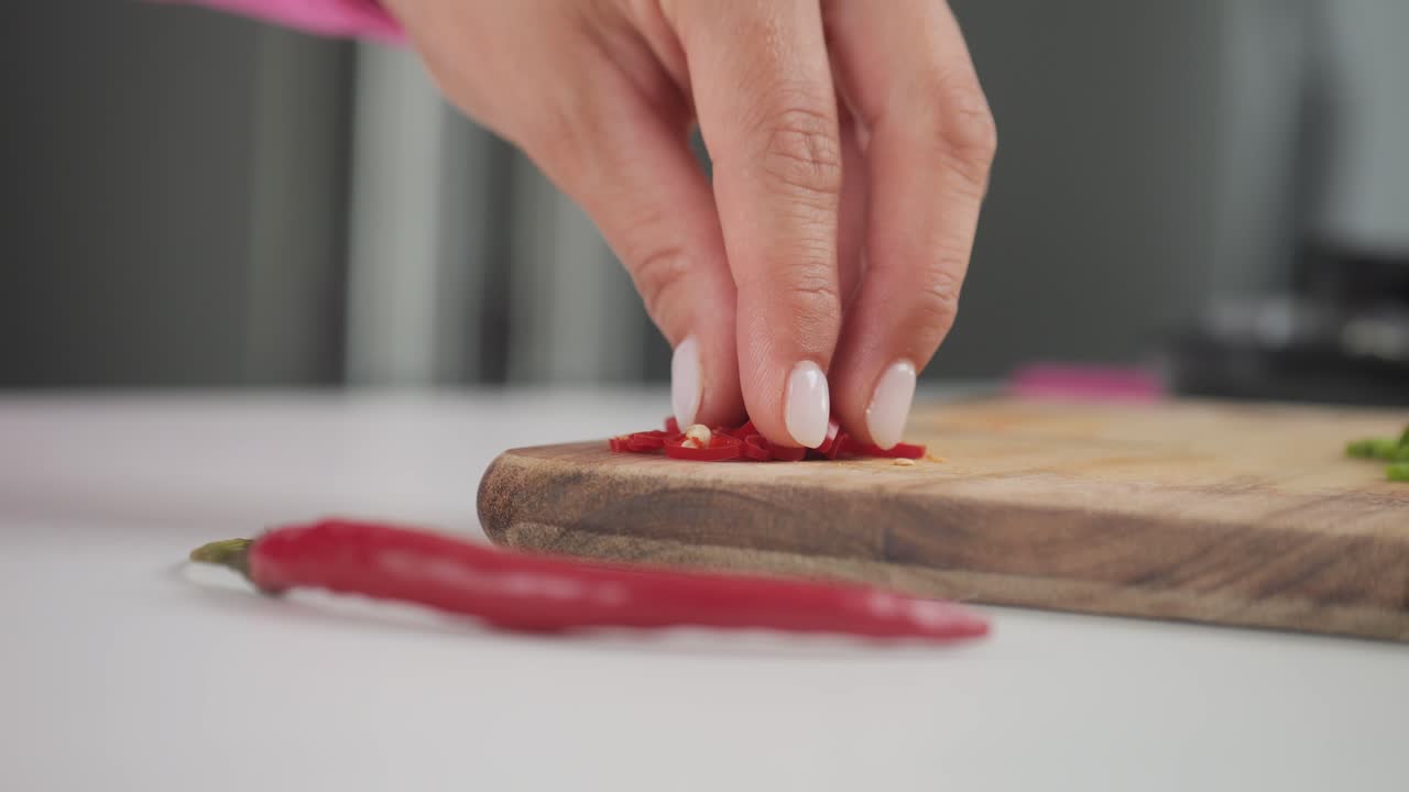 Spicy hot red peppers, close-up ingredients on cutting board