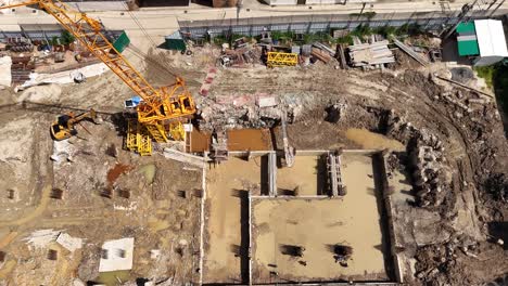 aerial view of large construction site with heavy machinery