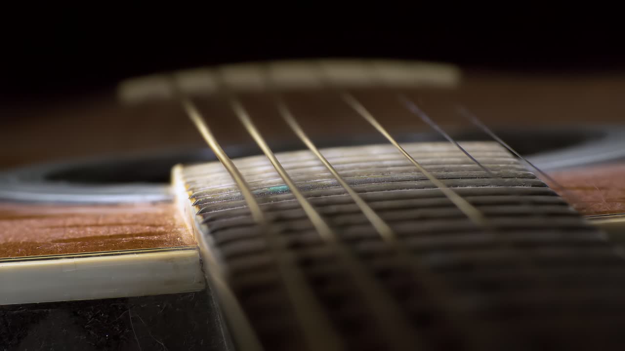 Acoustic guitar strings vibrating, Shot on super slow motion camera 1500 fps