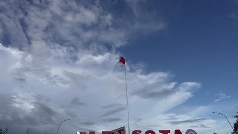 the red and white flag flies at the indonesian border, papua new guinea