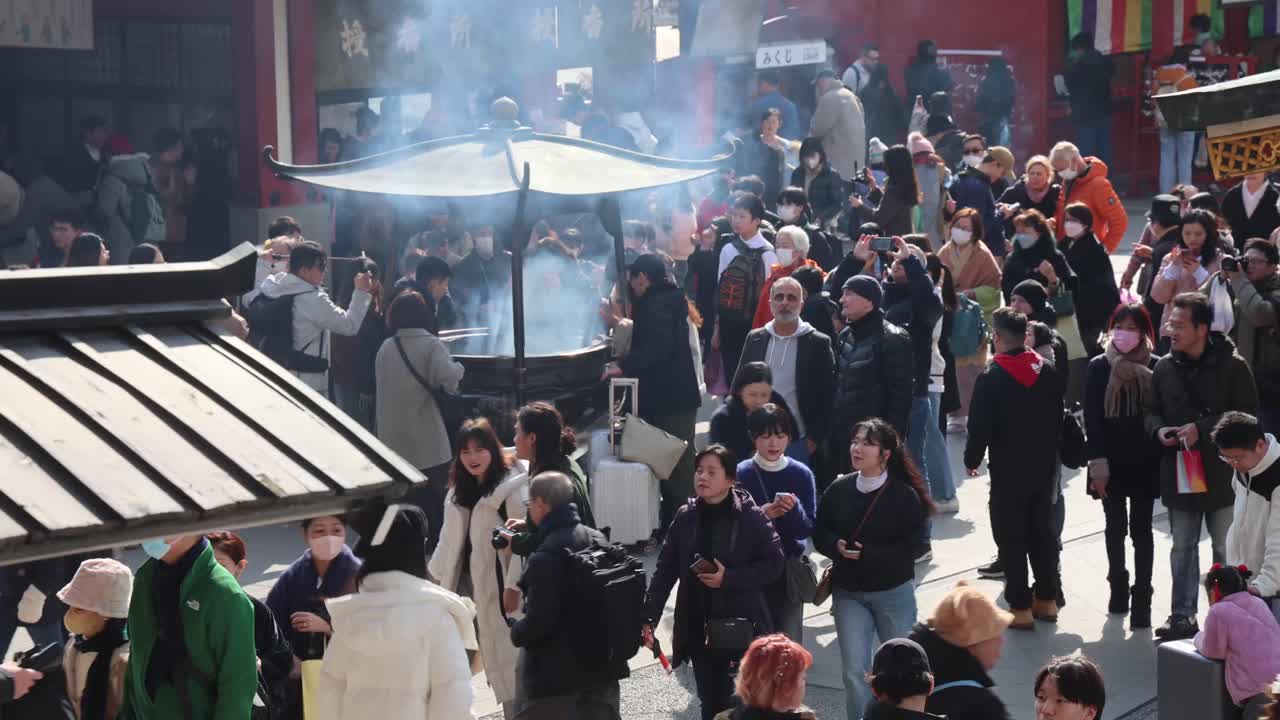 Experience the vibrant energy of Asakusa Temple in Tokyo, where visitors gather amidst traditional architecture and cultural rituals. A snapshot of life at one of Japan’s most iconic spiritual sites