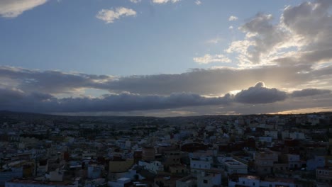 melilla city sunset with clouds and sun