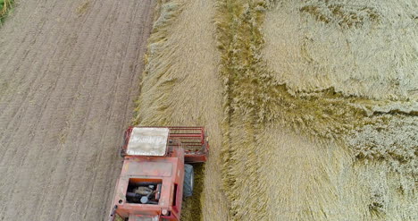 Combine-Harvester-Working-In-Agricultural-Field-1