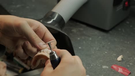 dental technician polishing cnc-milled zirconia crowns