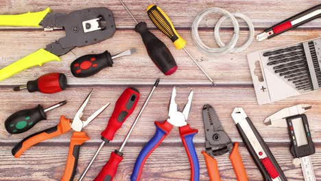 two pliers appear on table with construction tools - do it yourself stop motion