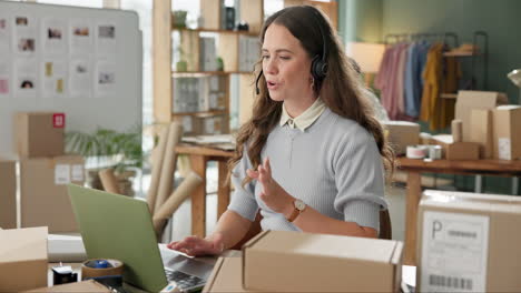 woman working at a home-based business using a headset and laptop to communicate with customers