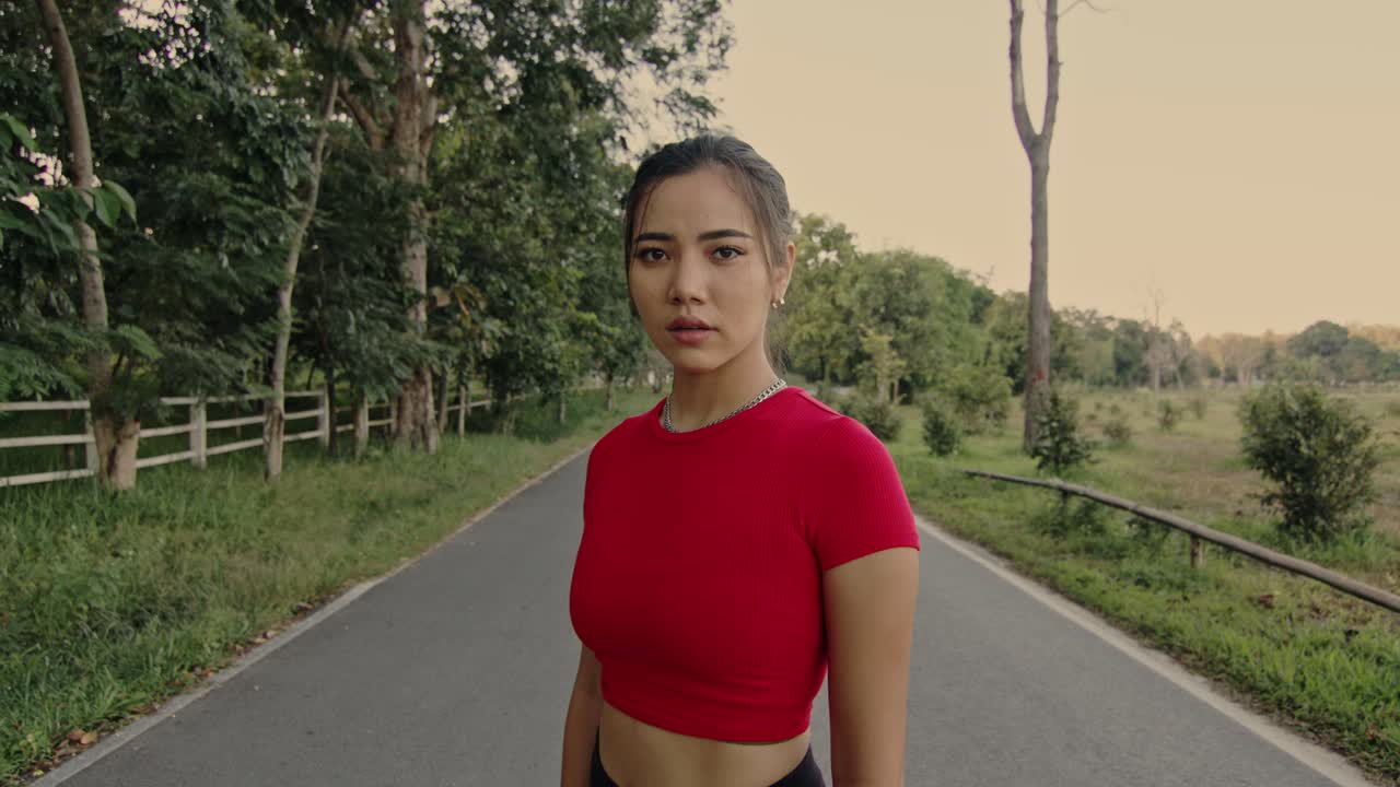 Young Woman Standing on a Road