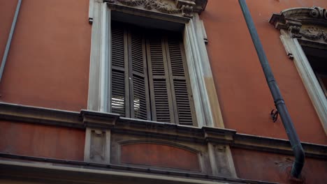 old italian building facade with shutters