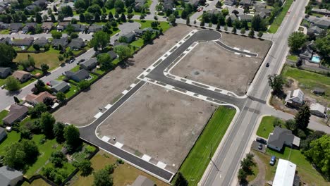 aerial over a paved neighborhood prior to construction