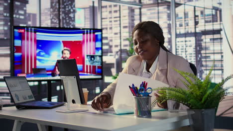 businesswoman in video conference during news report