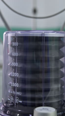 ventilator pump working in the surgery room. close up. equipment in modern clinics. blurred backdrop. vertical video