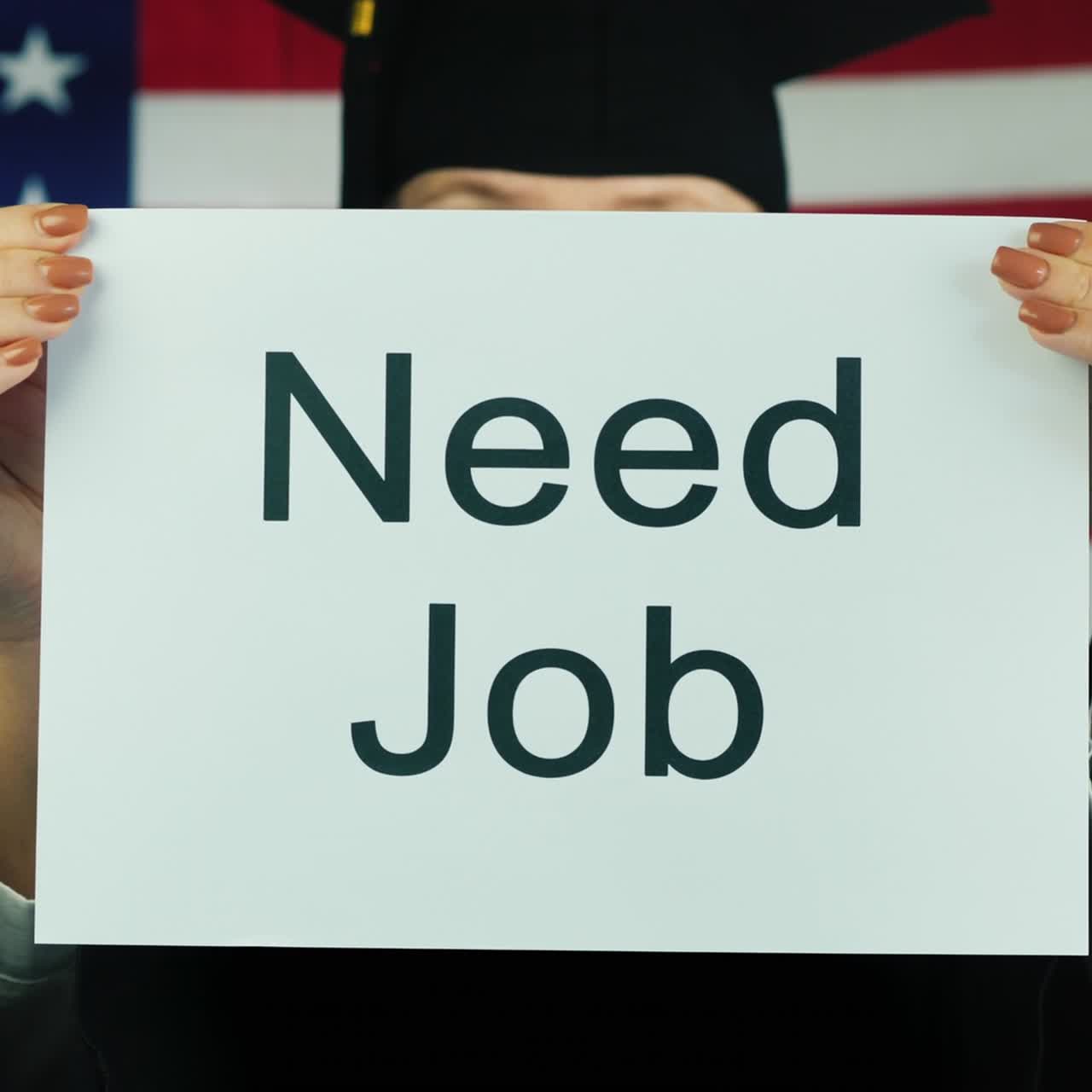 A Graduate In A Mantle And Cap Is Holding A Poster Need Job
