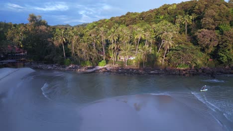 lonely hut under palm trees on natural dream beach