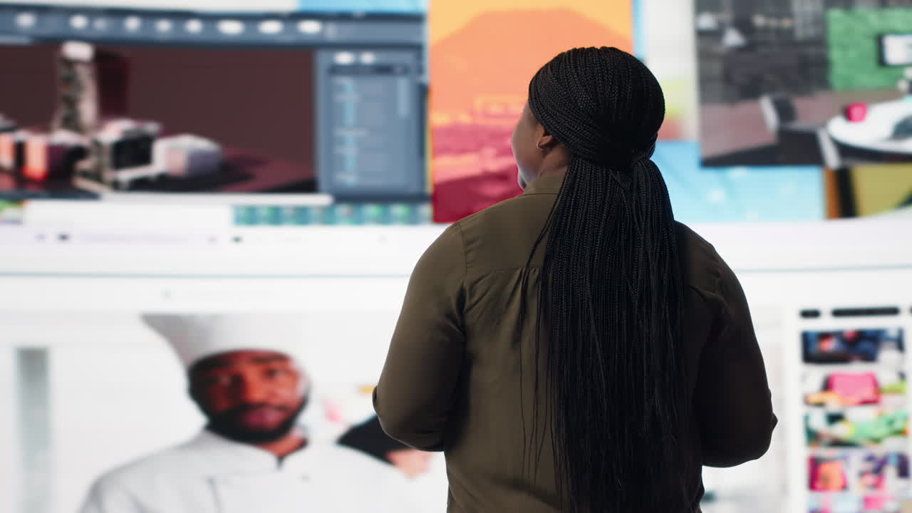 Viewer looking at video wall, watching content, enjoying digital age lifestyle