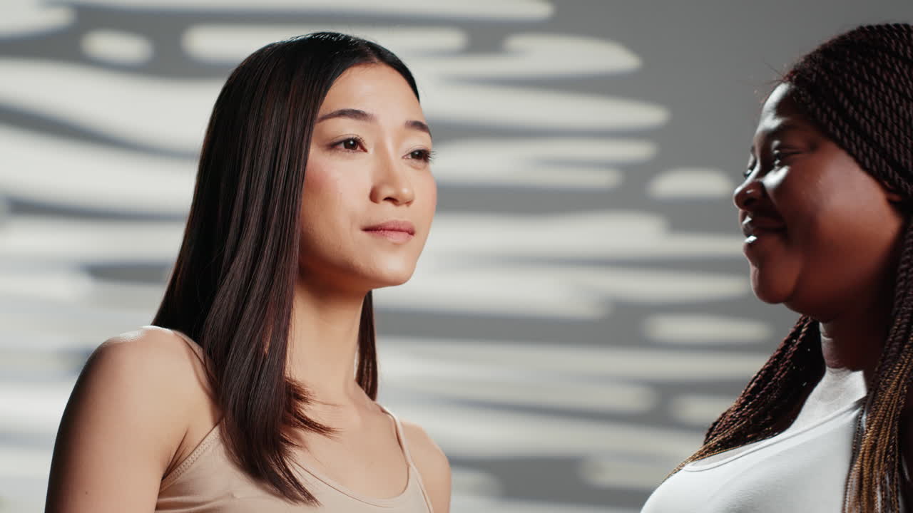 Two Diverse Women Sharing a Happy Secret