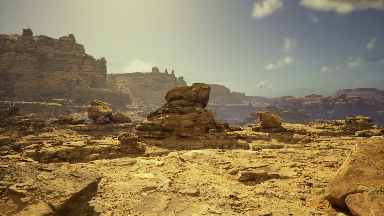 Vast desert landscape showcasing rocky formations under bright sunlight