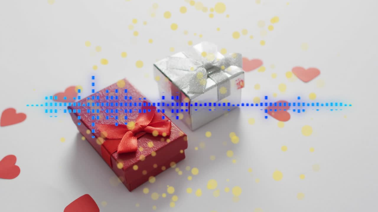 On play blue waveform pulsing and shifting while yellow particles drifting, showing two gift boxes