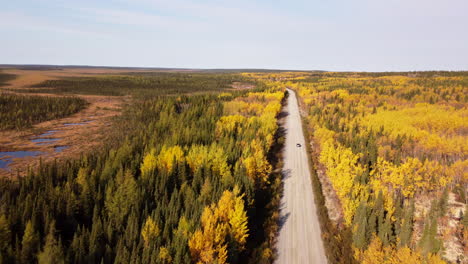 car driving in desert road of eeyou istchee baie-james quebec canada