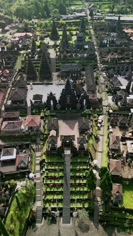 vertical video showcases besakih temple, bali’s largest sacred hindu temple, with layered shrines, intricate stone carvings, and serene surroundings on mount agung slopes