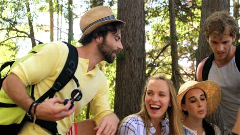 Hiker-couple-siting-and-watching-maps-