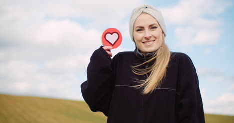 woman holding heart social media icon loving agriculture