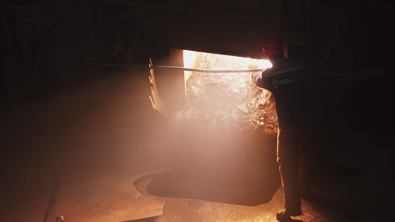 Worker in a metal furnace
