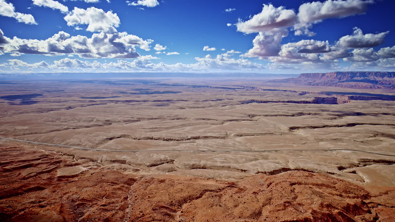 Mesmerizing bird’s-eye view tracking the cliff’s edge, emphasizing the sharp drop into the valley near Antelope Pass Vista.