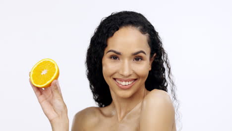 orange fruit, skincare and face of happy woman