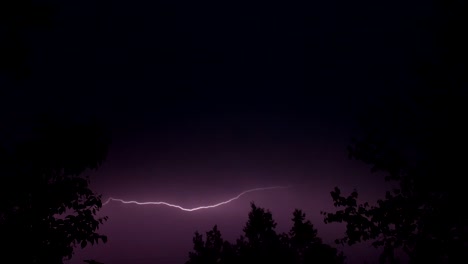 incredible pink lightning during a summer night