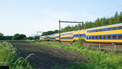 train passing through rural landscape