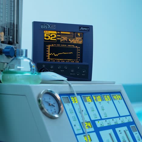 contemporary medical equipment in clinic. monitor showing graphics of the condition of a patient. operating theatre. plastic surgery. close-up.