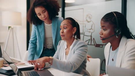 three businesswomen having a meeting in an office