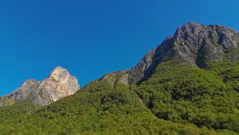 Aerial-of-the-peaks-and-hills-around-Rovde-near-Syvdefjorden-in-the-Vanylven-Municipality,-Norway