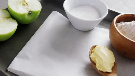 bowl of sugar and apple, flour with butter in spoon 4k