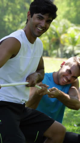 men pulling a rope in a tug of war